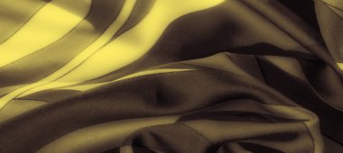 Görüntü, bu sarı ve siyah kumaşın dinamik tasarımını geliştirir. Sarı tabanlı koyu siyah çizgiler, sanatsal tekstil uygulamalarına uygun çarpıcı bir kontrastlık yaratır..