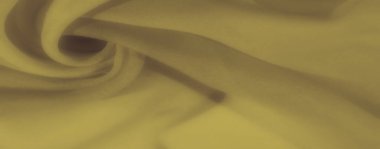 Yumuşak, akışkan kıvrımlı sarı kumaşlar. Sıcak, davetkar bir doku yaratıyor. Tekstil tasarımları, rahat arka planlar ve dekor projeleri için mükemmel..