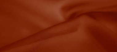 Yumuşak ve dokulu yüzeyi olan bulanık kırmızı kumaş, nazik dalgalar ve kıvrımlar sergiliyor. Herhangi bir projeye veya tasarıma sanatsal bir yetenek ekler.
