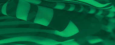 Karmaşık dalgalı çizgileri ve pürüzsüz katmanları olan yeşil kumaştan bulanık, gölge zıtlıklarıyla vurgulanmış, modern ve akışkan bir kumaş tasarımı sunuyor..