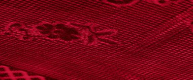 Görüntü. Şatafatlı ve yaratıcı cazibesini arttırmak için ışık ve gölge içeren karmaşık kafes tasarımlı koyu kırmızı kumaş..