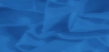 Yumuşak mavi kumaşın bulanık kıvrımları karmaşık ayrıntılar ve ince ışık yansımaları. Dekor ve sanatsal esinlenimler için mükemmel barışçıl ve çok yönlü bir tasarım sunuyor..