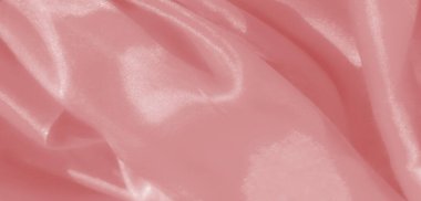 Bulanık - yumuşak, pembe bir kumaş, yumuşak kıvrımlı, yumuşak kıvrımlı ve narin bir parıltı. Işık yansıması onun lüks görünümünü arttırır..