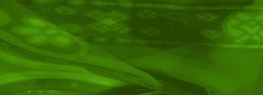 Karmaşık girdap desenleri ve ince pırıltıları olan göz kamaştırıcı yeşil kumaş, moda ve dekor uygulamaları için lüks ve yumuşak bir doku sunuyor..