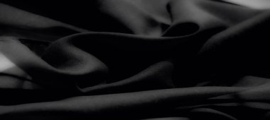 Yumuşak siyah kumaşın zarif, çok yönlü ve yaratıcı tasarım arka planları için mükemmel modern mat kaplamalı ince dokusu bulanıklaşır.