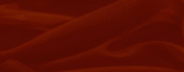 Bulanık kırmızı renkli kumaş kıvrımları ve ince ışık etkileşimini yakalar, tasarım, dekor veya sanatsal amaçlar için mükemmel desenli ama yumuşak bir yüzey sunar..