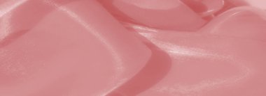 Görüntü - dalgalı dalgalı dalgalı ve yansıtıcı parıltılı pürüzsüz pembe saten kumaş. Yumuşak, akışkan kıvrımlar huzurlu ve romantik bir görsel izlenim yaratır..