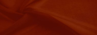 Görüntü: İnce dokuları ve akışkan kıvrımları olan canlı kırmızı bir kumaş tasarım projeleri veya tekstil fotoğrafçılığı için zarif ve çağdaş bir estetik sunar.