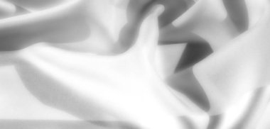 Gri tonlu, pürüzsüz, yumuşak ve ince gölgeli gri kumaş kıvrımları sanatsal altyapılar ve kumaş tasarımları için mükemmel bir incelik sunuyor..