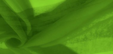 Akan kıvrımları ve şeffaf parıltısı olan canlı yeşil kumaş bulanıklığı. Zarif katmanlar ve yumuşak eğriler doğal dokusunu ve ışıltılı cazibesini arttırır.