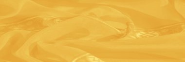 Görüntü, ahenkli çiçekli ve geometrik tasarımlı çarpıcı sarı kumaş incelik ve incelik sergiliyor. Dekorasyon için mükemmel..