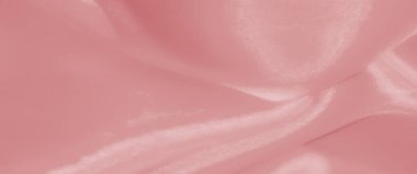 Görüntü. Yumuşak, akışkan pembe saten kumaş. Pürüzsüz kıvrımları ve parıldayan ışıltıları var. Şatafatlı ve zarif bir dokuyu yakalıyor..