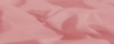 Pembe kumaş, kıvrımlı ve ince gölgeler, zarif ve sanatsal bir doku sunuyor şık arka planlar ya da tekstil temalı görseller için mükemmel..