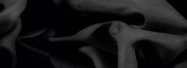 Karmaşık kıvrımları ve yumuşak perdeleri olan bulanık siyah kumaş dokusu. Kusursuz tasarım ve aydınlık ve karanlığın zarif etkileşimi onu minimalist ve yaratıcı görseller için ideal bir seçim yapar..