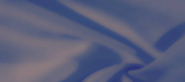 Bulanık yumuşak mavi kumaş kıvrımları zarifçe taşarak, yumuşak kıvrımları ve dokuları olan sakin ve soyut bir kompozisyon oluşturur. Tasarım ve yaratıcı projeler için mükemmel.