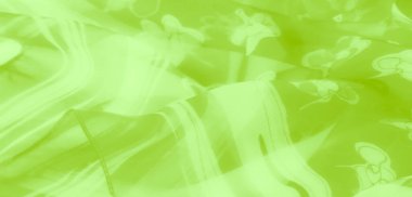 Karmaşık çiçek desenli bulanık kireç yeşili kumaş ince şeffaflıkla yumuşak ve akışkan bir doku yaratıyor. Malzeme ışığı güzel yansıtıyor..