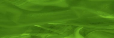 Yumuşak dokuları ve yumuşak kıvrımları olan yemyeşil kumaş bulanıklığı, yumuşaklık ve zarafet yayan ahenkli ve akıcı bir tekstil deseni yaratır..