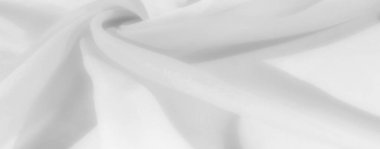 Açık renk kumaş kıvrımları, sakin ve minimalist görünümlü narin bir doku oluşturur. Tarafsız arka planlar ve zarif tasarım elemanları için harika..