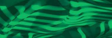 Bu soyut kumaş tasarımında yeşil tonların ve akan çizgili desenlerin dinamik etkileşimi. Pürüzsüz dokusu ve kalın çizgileri entelektüelliği çağrıştırıyor..