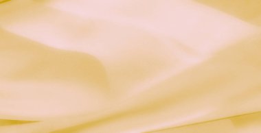 Zarif dalgaları ve ince kıvrımları olan yumuşak dokulu sarı bir kumaşı bulanıklaştırın. Kusursuz ve narin tasarımı rahatlatıcı ve zamansız bir görsel deneyim sunuyor..