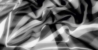 Bulanık, hafif kıvrımlı gri pullu kumaş ve ışık ve gölgelerle dokulu karşıtlıklar. Dekor ve moda için mükemmel, sofistike ve minimalist bir kompozisyon sunuyor..