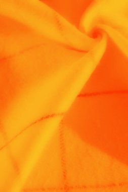 Üst üste binen kıvrımlı turuncu ve sarı dokular ve canlı renkler, soyut görsel bileşimlerde enerji ve yaratıcılığı çağrıştırıyor..