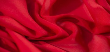 Yumuşak, akışkan kıvrımlı, yumuşak kırmızı kumaştan bulanık, zengin bir doku ve dinamik derinlik sergiliyor. Özgeçmiş, tekstil tasarımı ve soyut görseller için çok yönlü bir kompozisyon.