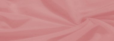 Yumuşak, narin kıvrımları olan bulanık pastel pembe kumaş, arka planlara zarafet ve zarafet ekleyerek ve yaratıcı tekstil tasarımları ekleyerek dingin bir doku oluşturur..