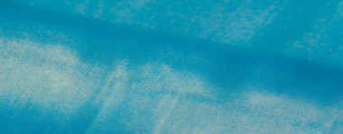 Bulanık, parlak kumaş kıvrımları zarif dalgalar halinde parlak, saten gibi bir yüzeyi olan ve ışığı yansıtan ve sofistike bir his yayan..