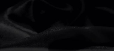 İnce detaylar ve ince gölgeli siyah kumaş bulanıklığı, modern tekstil veya tasarım arka planları için kusursuz ve stil dolu bir estetik yaratıyor.
