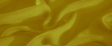 Yumuşak, akışkan kıvrımları ve hassas dokusu olan altın sarısı kumaş bulanıklığı. Pürüzsüz görünüş ve nazik kıvrımlar lüks materyali vurgular..