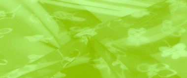 Görüntü. Benzersiz çiçek desenli canlı yeşil bir kumaş. Saf doku ve yumuşak katmanların kombinasyonunu sunuyor. Modern ve zarif tasarım uygulamaları için mükemmel..