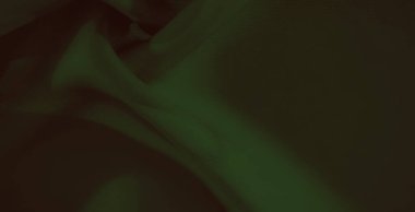 Koyu yeşil kumaş kıvrımları yumuşak gölgeler ve ince dokular, zarif kumaşlar ve hafif ışık altında pürüzsüz, mat bir görünüm..