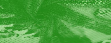 Bulanık desenli yeşil kumaş, örülmüş görünüm ve yumuşak, yansıtıcı röfleler. Bu soyut materyal, herhangi bir yaratıcı projeye derinlik ve modern estetik katar..