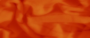 Görülebilir kesişen ızgara çizgileri ve pürüzsüz kıvrımları olan bulanık turuncu kumaş. Yumuşak madde ve sıcak renk, sahneye parlayan estetik ve dinamik bir doku ekler..