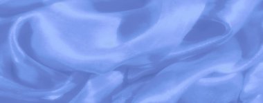 Bulanık açık mavi kumaş zarif kıvrımları ve parıldayan yüzeyi olan zengin, parlak bir dokuyu gösterir. Zarif ve yaratıcı tasarım projeleri için idealdir..