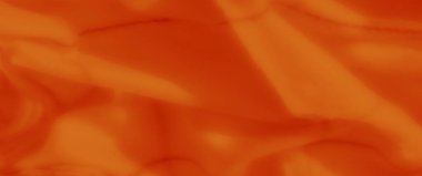 Yumuşak kıvrımlı parlak turuncu kumaş ve görünür doğrusal desenler. Yumuşak doku ve dinamik gölgeler çarpıcı bir soyut kompozisyon oluşturur.