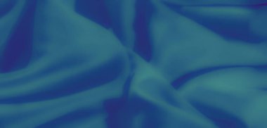 Süpürücü kıvrımları ve nazik kıvrımları olan mavi kumaş bulanıklığı. Yumuşak madde sükuneti yayar, sanatsal ve rahatlatıcı bir görsel deneyim yaratır..