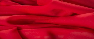 Görüntü - Pürüzsüz kıvrımları ve narin dokusu olan canlı kırmızı bir kumaş, yumuşak ve lüks bir görünüm sergiliyor tasarım ve moda için mükemmel.