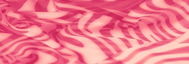 Yumuşak kıvrımları ve pürüzsüz geçişleri olan pembe çizgili kumaş bulanıklığı. Bu soyut tekstil deseni derinlik ve doku ekler, yaratıcı projeler veya arka planlar için idealdir.