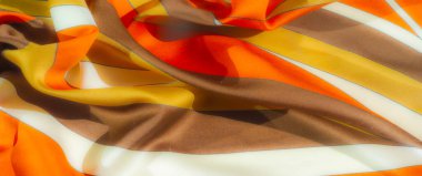 Kalın, sıralı turuncu, sarı ve kahverengi şeritli kumaş bulanıklığı. Pürüzsüz yüzey ve canlı renkler dcor için mükemmel modern tekstil tasarımı yaratır.