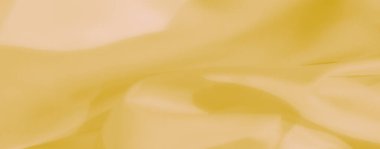 Zarif dalgaları ve ince kıvrımları olan yumuşak dokulu sarı bir kumaşı bulanıklaştırın. Kusursuz ve narin tasarımı rahatlatıcı ve zamansız bir görsel deneyim sunuyor..