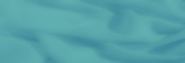 Yumuşak, akıcı dokuları olan bulanık deniz mavisi kumaşları. Soyut tasarım, sanatsal arkaplan veya tasarım projeleri için mükemmel, rahatlatıcı bir görsel estetik yaratır..