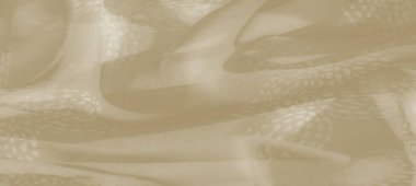 Yumuşak, akışkan bir tasarımı ve karmaşık desenleri olan bulanık bej tekstil. Nazik dalgalar ve hafif tonlar doğal bir çekiciliği olan sakin, zarif bir estetiği çağrıştırıyor..