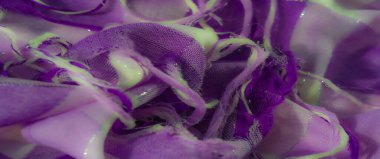 Karmaşık dokularla parıldayan mor kumaşın bulanık tabakaları ve yumuşak, lüks bir his üst düzey tekstil tasarımı ve dekoratif amaçlar için ideal..