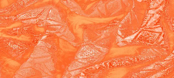 Bulanık Bu resim parlak turuncu bir kumaşa sahip soyut şekillere ve dokulara sahip, ışık yansımalarıyla vurgulanmış. Kompozisyon kumaşın pürüzsüz, akışkan dokusunu vurguluyor.