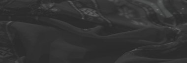 Geometrik desenlerin dengeli bir karışımı ile çiçek desenleri içeren bulanık, koyu renk kumaş, sofistike ve sanatsal bir tekstil sunar.