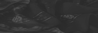 Belirsiz koyu tonlarda soyut ve geometrik motiflerin karışımını içeren bulanık kumaş, atmosferik tekstil tasarımları ve şık arka planlar yaratmak için ideal.