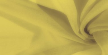 Yumuşak sarı kumaştan bulanık, sıcak ve samimi bir ortam yaratmak için nazikçe bükülmüş ve katlanmış. Arka planlar, tekstil tasarımları ve kumaştan esinlenilmiş dekorlar için mükemmel..