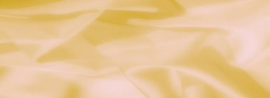 İnce dalgalı sarı kumaş bulanıklığı ve yumuşak, narin bir yüzey, sanat, fotoğrafçılık veya profesyonel tasarımlar için mükemmel bir doku sunuyor..